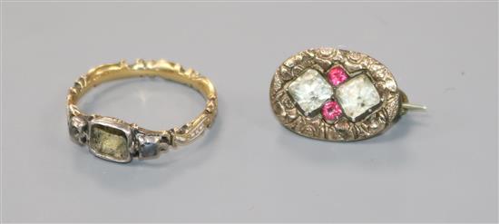 A George III yellow and white metal, enamelled mourning ring (central stone missing) and a 19th century gem set brooch.